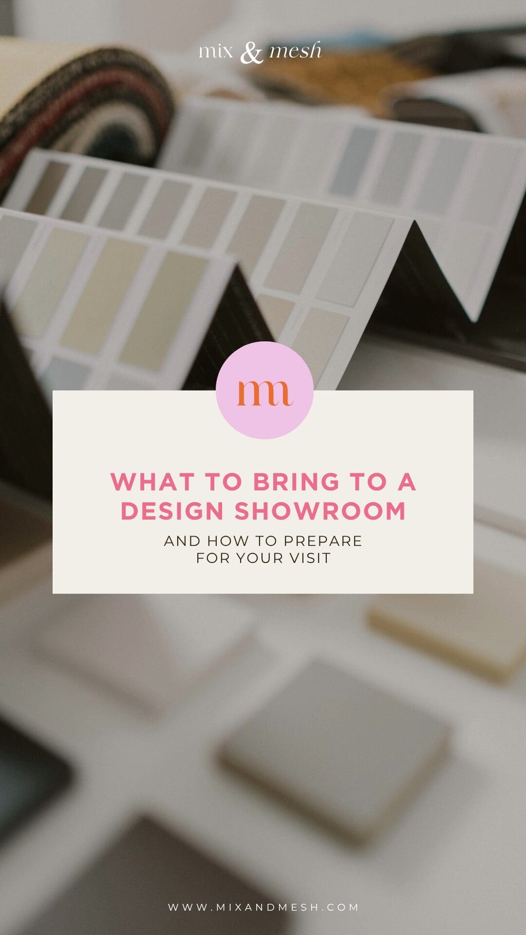 showroom table with open paint decks, tile samples, and fabric swatches