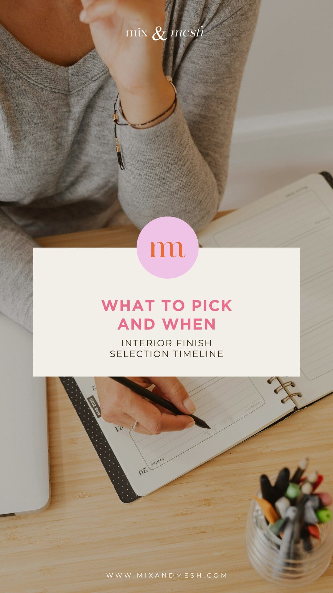 woman writing in planner with open calendar and home design notes